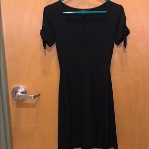 Black dress. Low cut. Very nice quality.